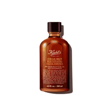 A graphic featuring a dark amber bottle of Kiehl's Ferulic Brew Facial Essence with a black cap. The label has white and yellow text that reads “100 ml". 