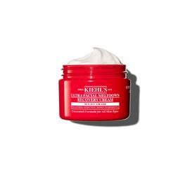 Czerwony słoiczek Kiehl’s Ultra Facial Meltdown Recovery Cream Whip o puszystej konsystencji bita śmietana.