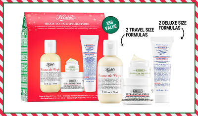 A festive gift set from Kiehl's featuring four hydrating products: two travel-size formulas and two deluxe-size formulas, all packaged in a decorative box with a holiday theme.