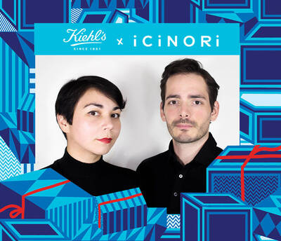 A man and a woman with short hairstyles pose side by side against a colorful background featuring gift boxes and graphics, representing a collaboration between Kiehl's and iCiNORI.