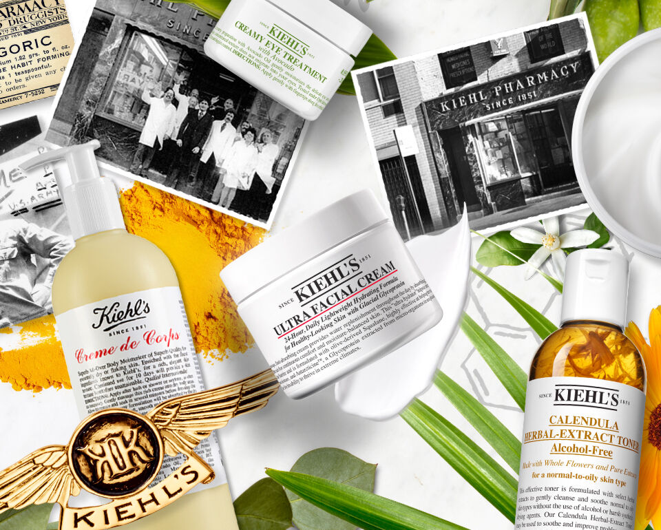Alt text: "Wizualizacja produktow kosmetycznych Kiehl's, w tym butelki z płynem, słoika z kremem i olejkiem, otoczona naturalnymi elementami."