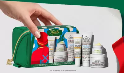 Hydrating Holiday Hits" skincare gift set on a green background, featuring Ultra Facial Cream and Creamy Eye Treatment with Avocado in festive packaging.​