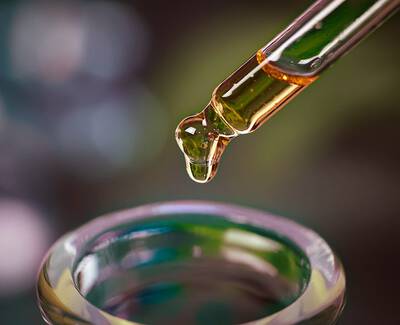 A close-up view of various roasted coffee beans spread out on a surface.