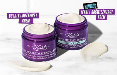 Two jars of Kiehl's Super Multi-Corrective Cream, one labeled "Rich & Nourishing Cream" and the other "New Lightweight Soft Cream," with a creamy texture swirled on the side.