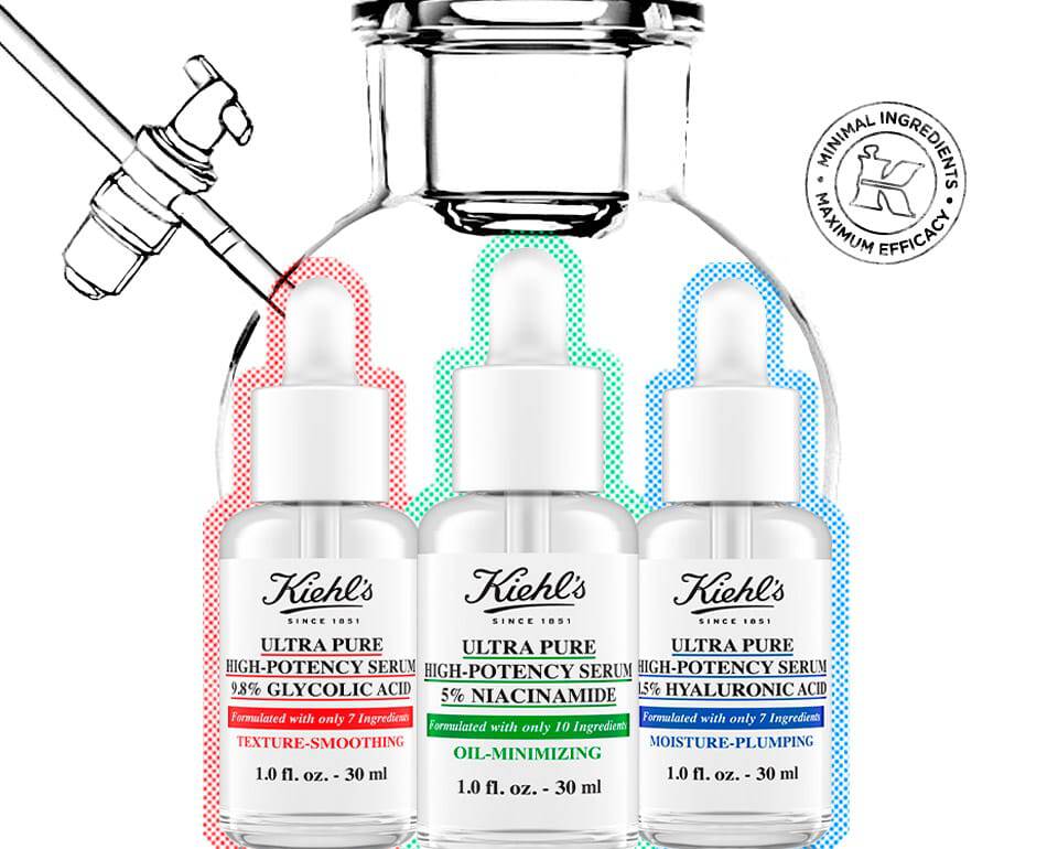 Trzy buteleczki serum do pielęgnacji skory Kiehl's, każda z kolorowym oznaczeniem: zielonym, czerwonym i niebieskim.