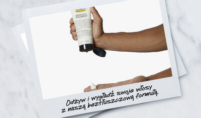 A hand pouring a non-greasy hair product into the palm, with text below that reads "Condition and smooth with a non-greasy formula."
